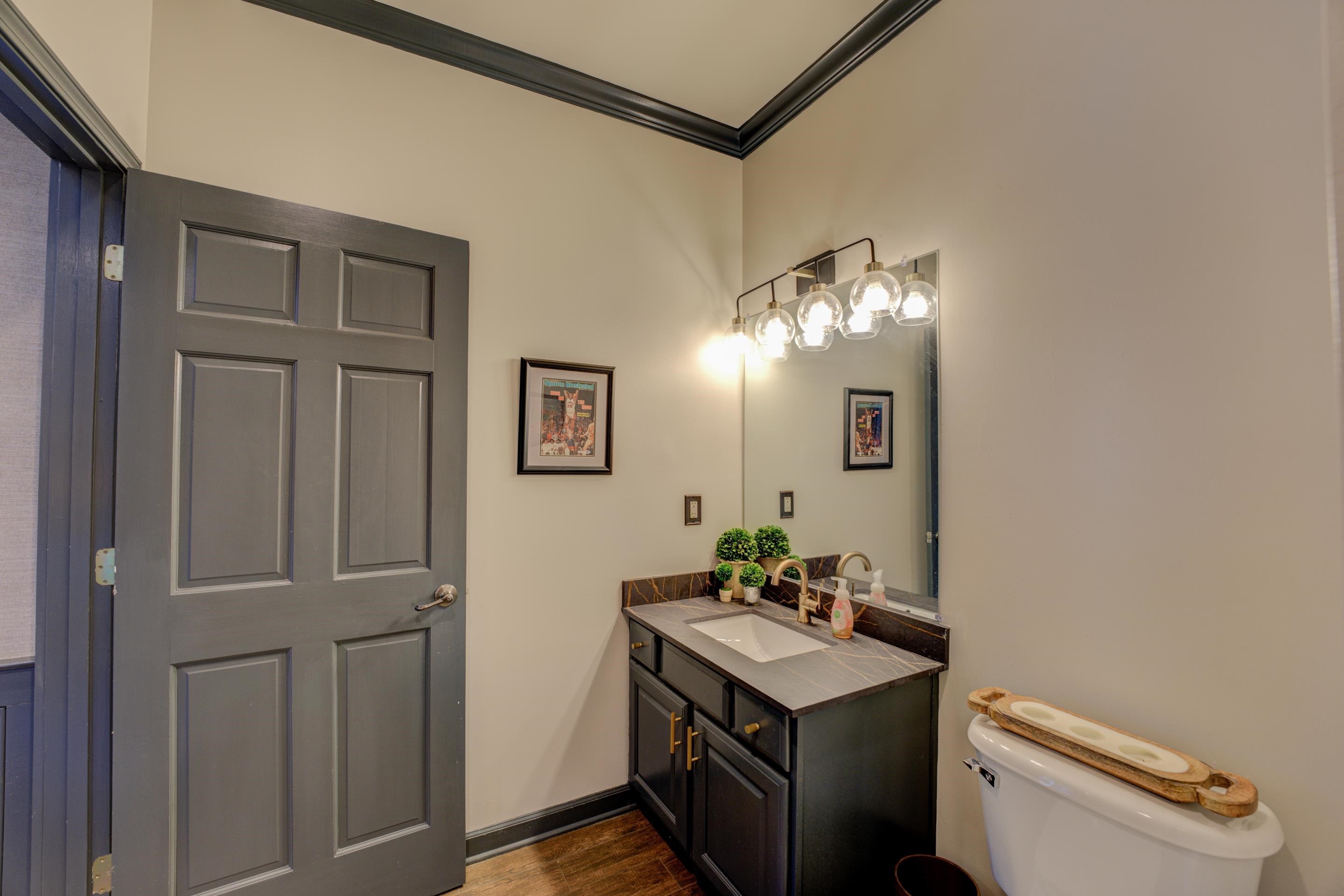 5074 Shady Grove Road Memphis, TN 38117 - Photo 22 of 25 Whether you're rinsing off after a refreshing swim or preparing for a night of entertainment, this updated bathroom in the pool house is a sanctuary of modern elegance.