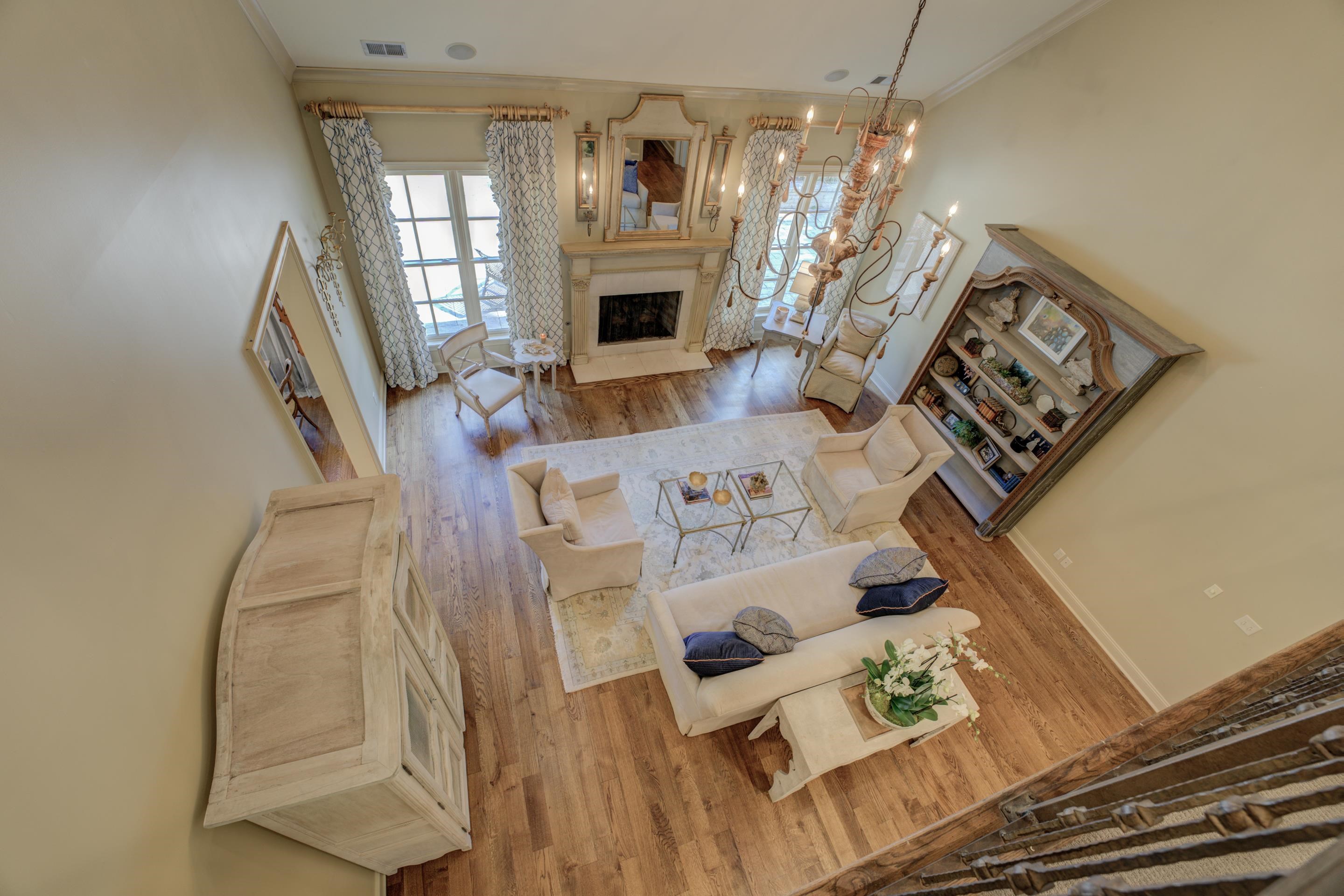 Whether you're curling up with a good book by the fireplace or hosting lively gatherings, this two-story great room exudes an undeniable sense of elegance and comfort.