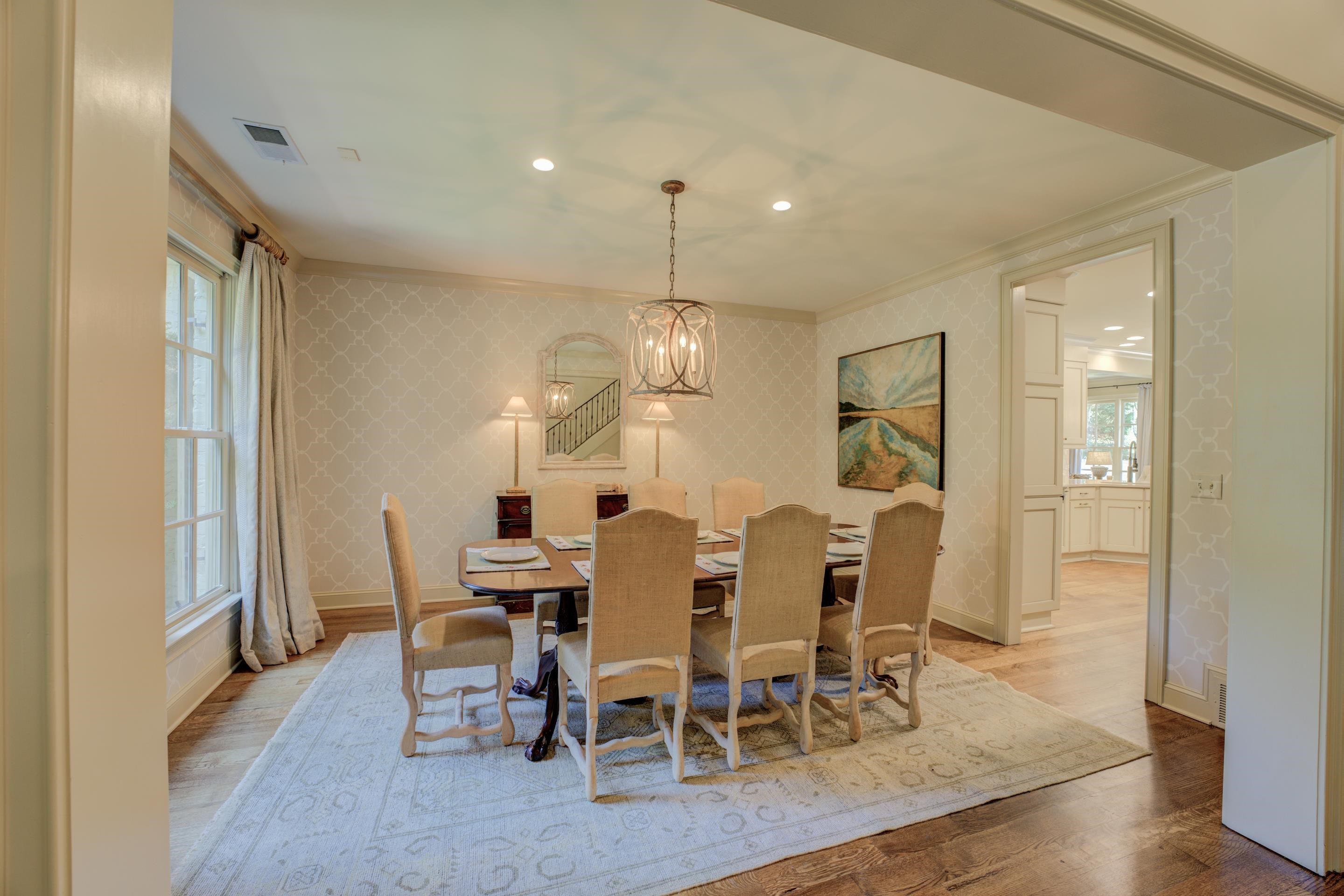 Indulge in the exquisite ambiance of a formal dining room that radiates elegance and invites unforgettable gatherings. Step into a space where every meal becomes a special occasion, adorned with impeccable details and refined aesthetics.