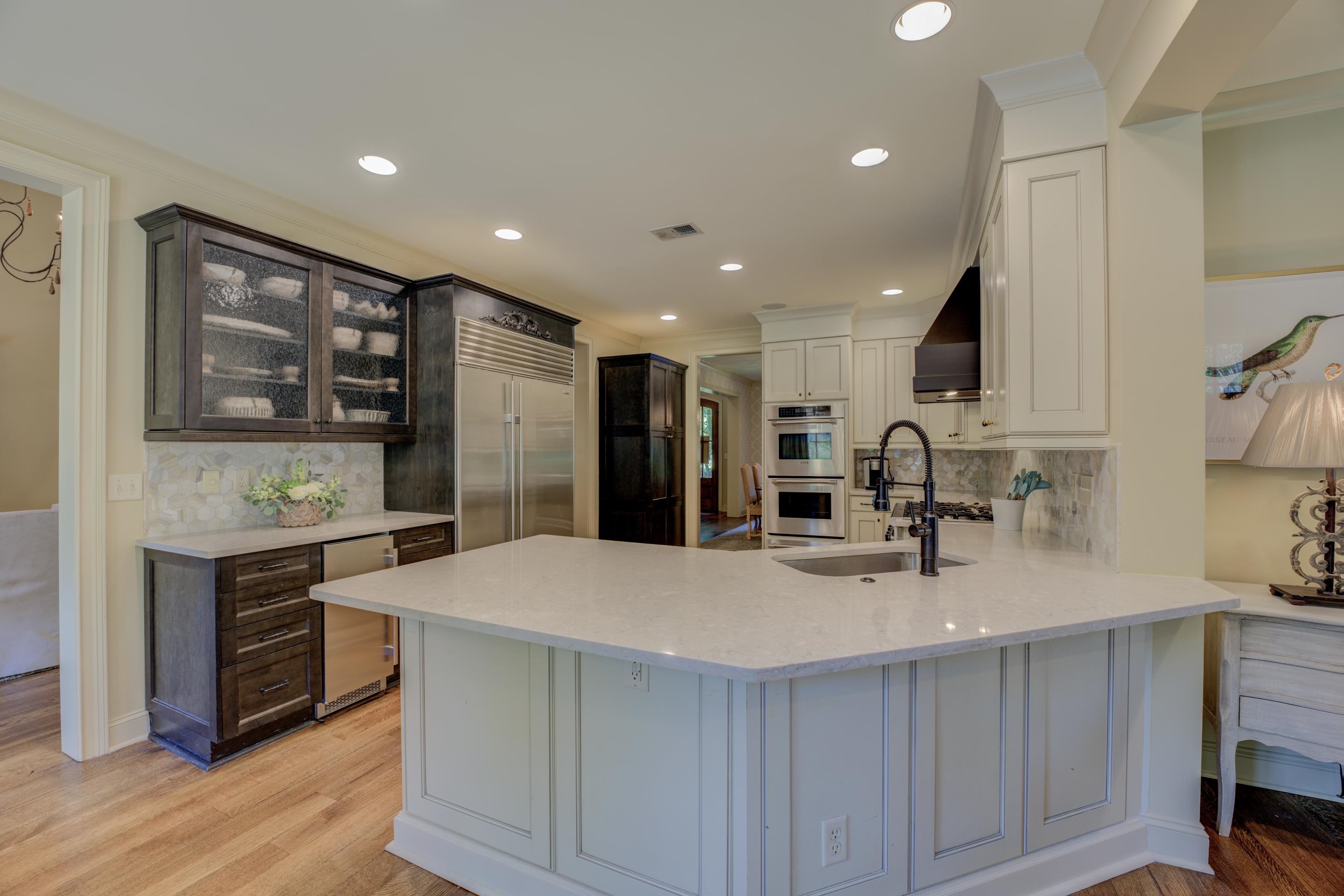 Prepare to be dazzled by the culinary masterpiece that awaits you - a gourmet kitchen adorned with granite countertops, sleek stainless steel appliances, tile backsplash and a convenient breakfast bar.
