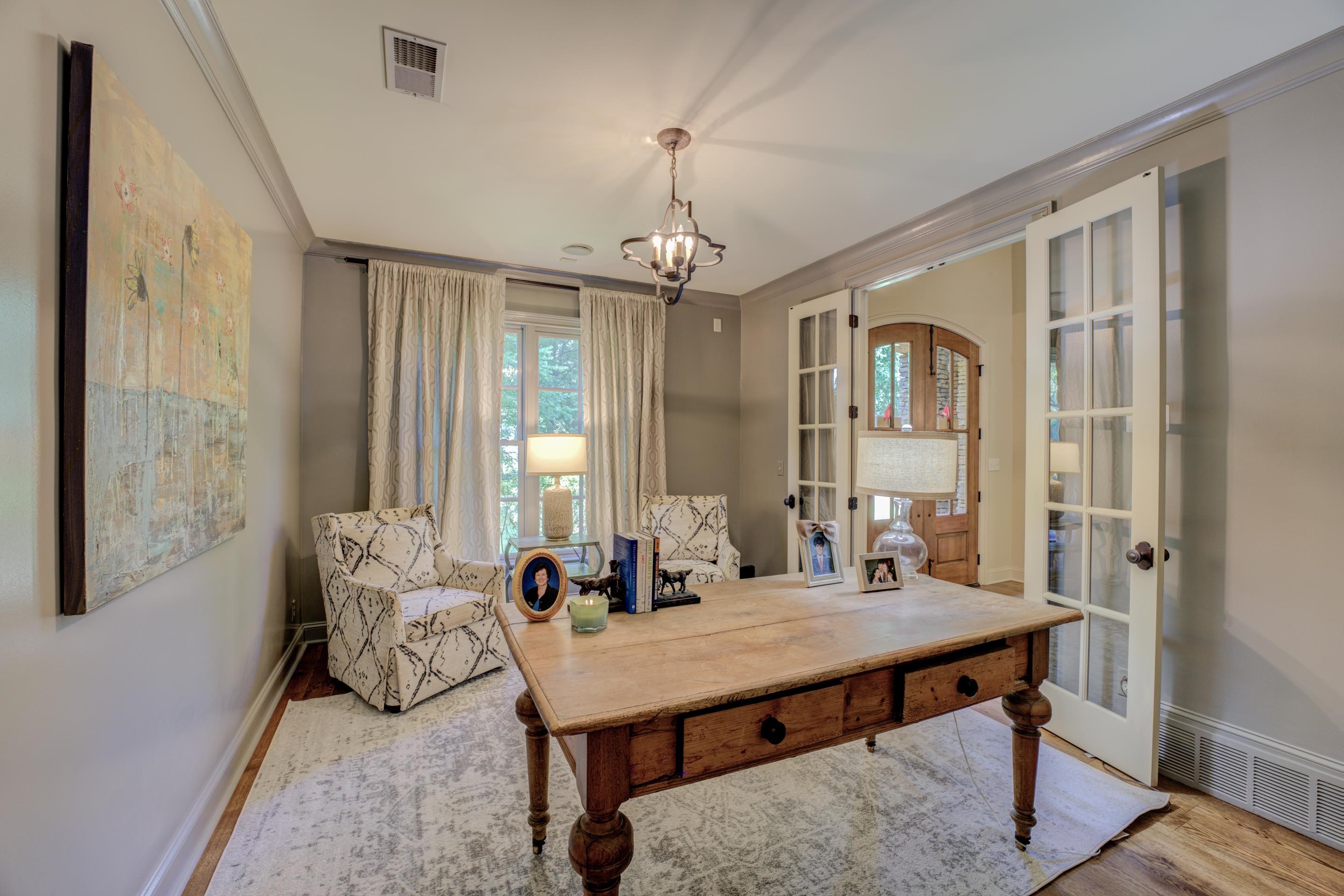 5074 Shady Grove Road Memphis, TN 38117 - Photo 9 of 25 Enjoy your own personal sanctuary within the comforts of home - a stunning home office adorned with elegant French doors. As you sit at your desk, surrounded by the warmth and charm of the room, you'll feel inspired and focused.