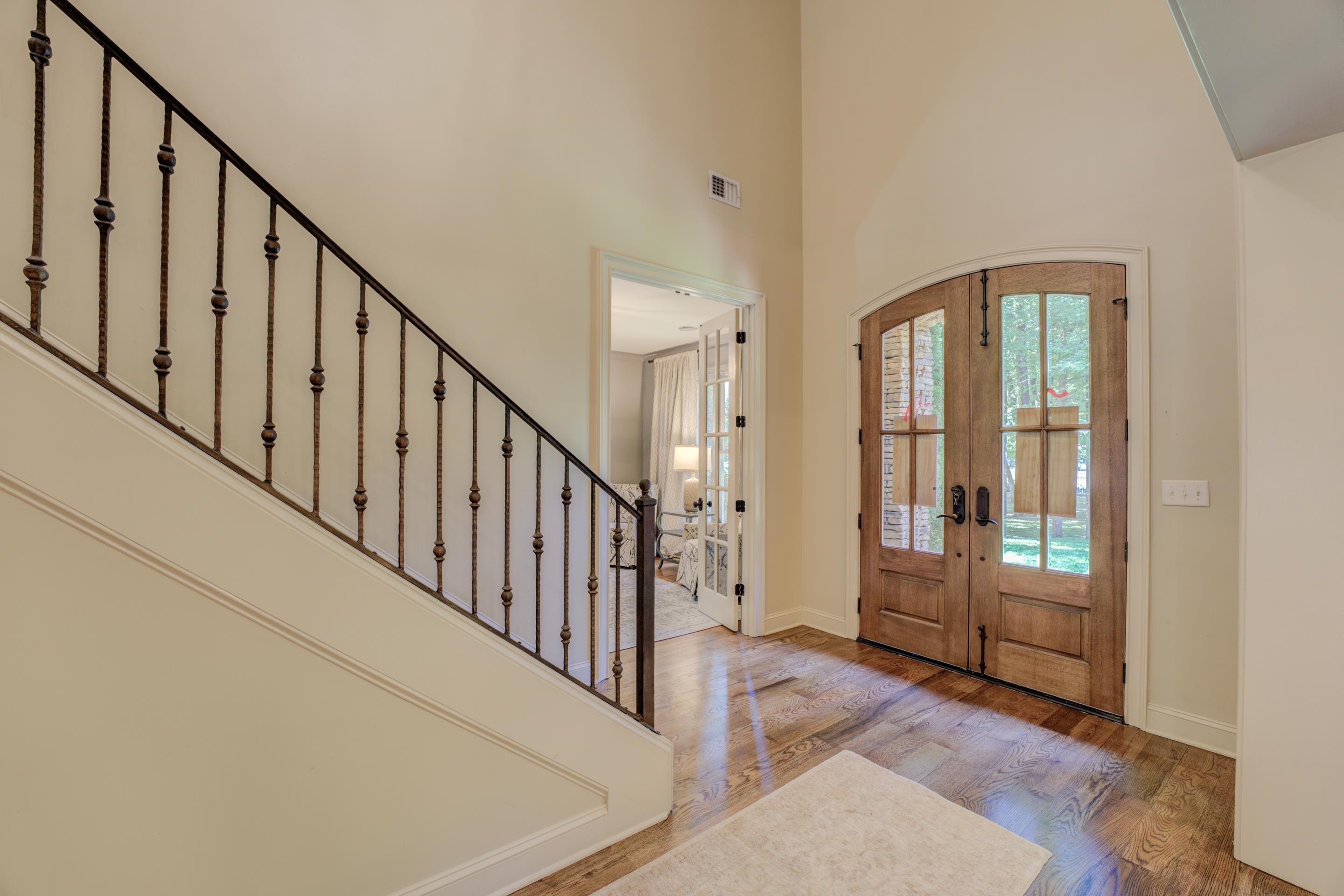 5074 Shady Grove Road Memphis, TN 38117 - Photo 10 of 25 Prepare to be greeted by grandeur as you step into the magnificent two-story entryway of this extraordinary home. From the moment you cross the threshold, you are enveloped in an atmosphere of elegance and sophistication.