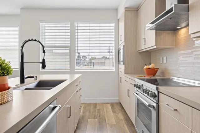 a kitchen with a sink and a stove