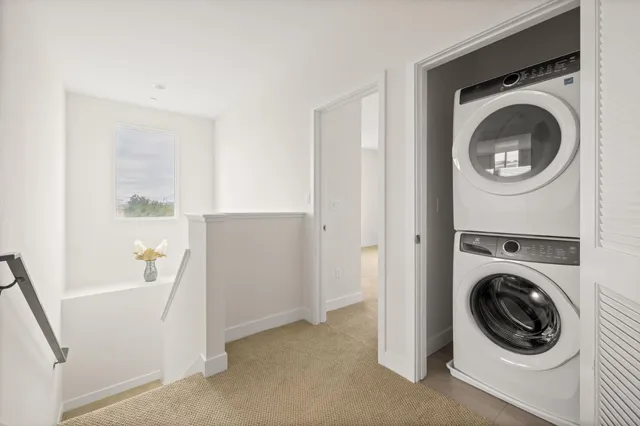 a view of a hallway with washer and dryer