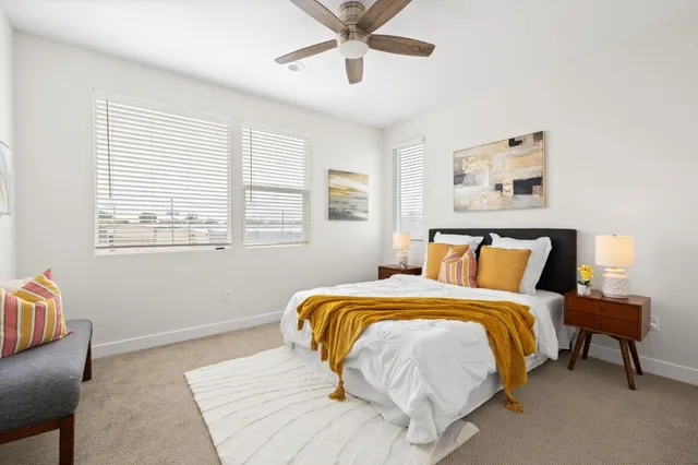 a bedroom with a bed and window