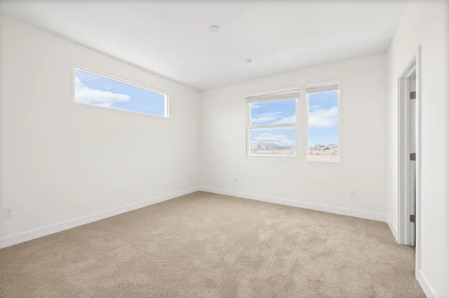 an empty room with a empty space and window