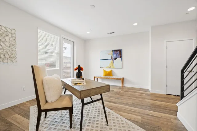 a workspace with furniture and window