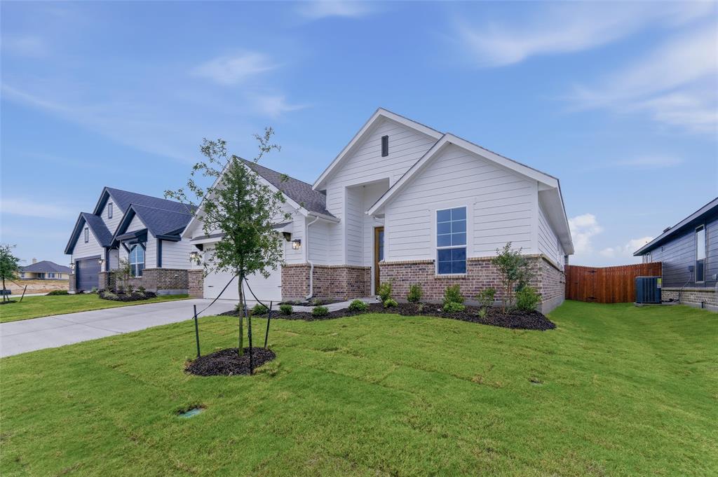 1329 Frio Drive Springtown, TX 76082 - Photo 4 of 25 Contemporary single-story residence featuring white siding and a brick facade