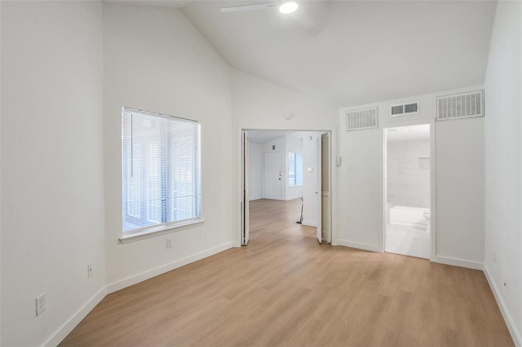 5550 Spring Valley Road, Unit D31 Dallas, TX 75254 - Photo 13 of 19 an empty room with windows and closet