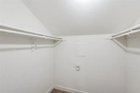 a bathroom with a toilet a sink a tub and a mirror