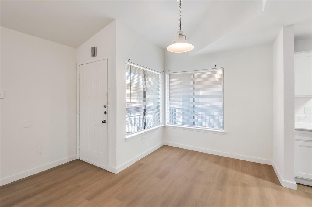 5550 Spring Valley Road, Unit D31 Dallas, TX 75254 - Photo 6 of 19 a view of an empty room with a window