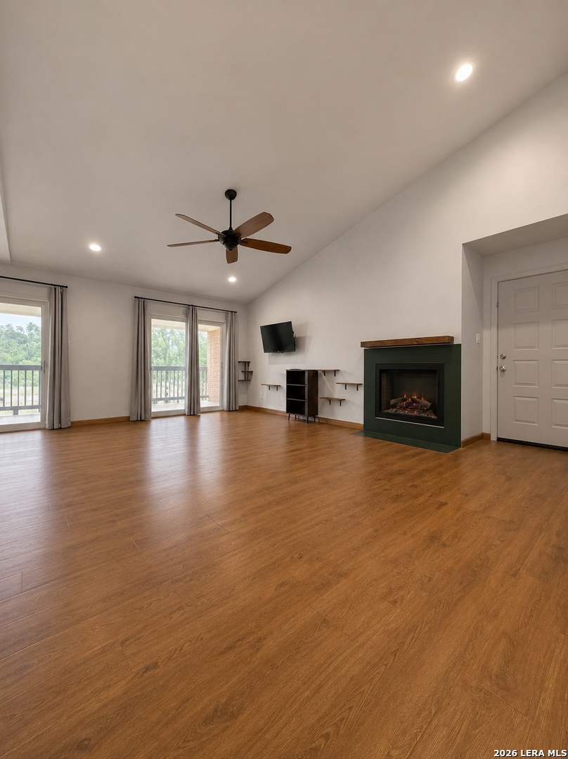 14343 Judson Road, Unit 302 San Antonio, TX 78233 - Photo 8 of 14 an empty room with furniture and a fireplace