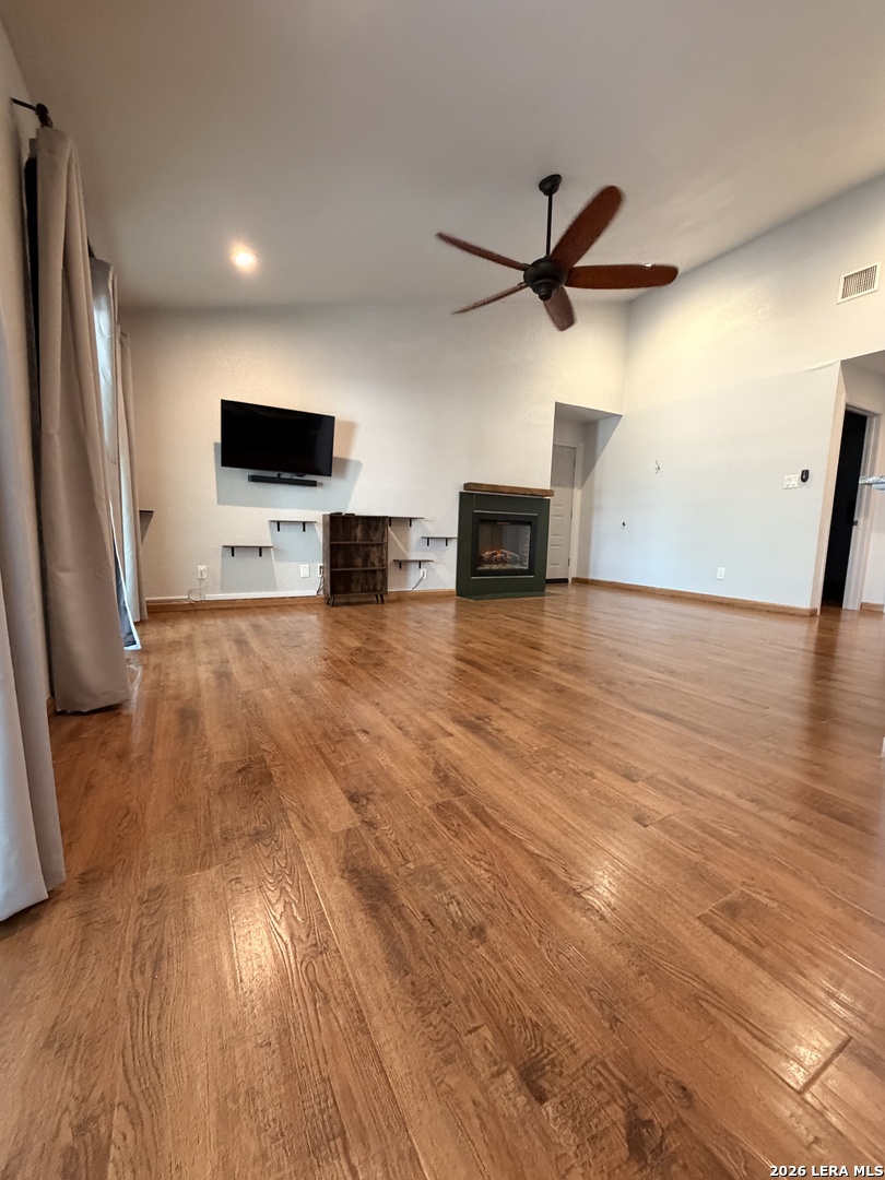 14343 Judson Road, Unit 302 San Antonio, TX 78233 - Photo 9 of 14 a view of a livingroom with furniture a flat screen tv and wooden floor