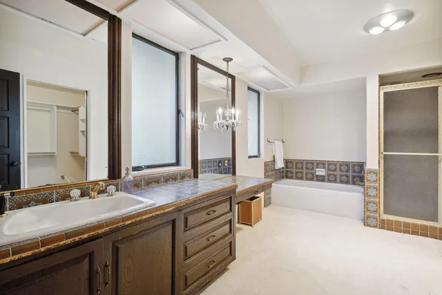 a bathroom with a granite countertop sink mirror and double