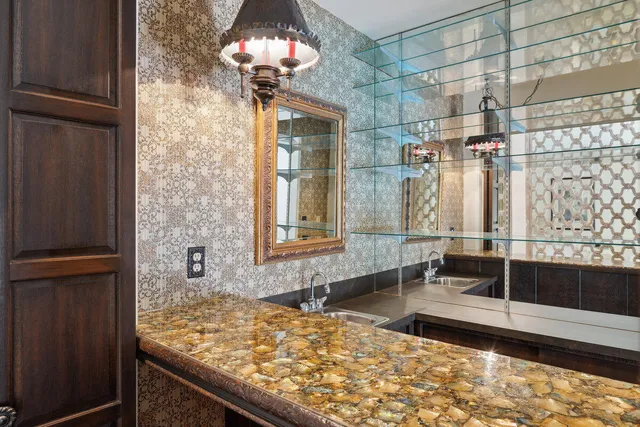 a view of a bathroom with a tub and shower