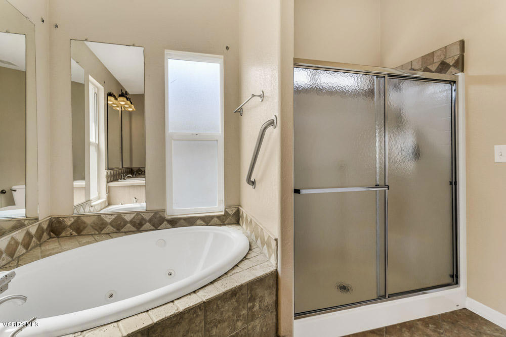 15535 LaPeyre Road Moorpark, CA 93021 - Photo 25 of 34 a bathroom with a bathtub and a shower