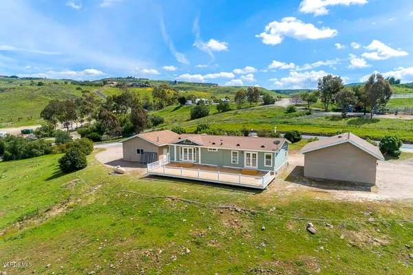 a view of a house with a big yard