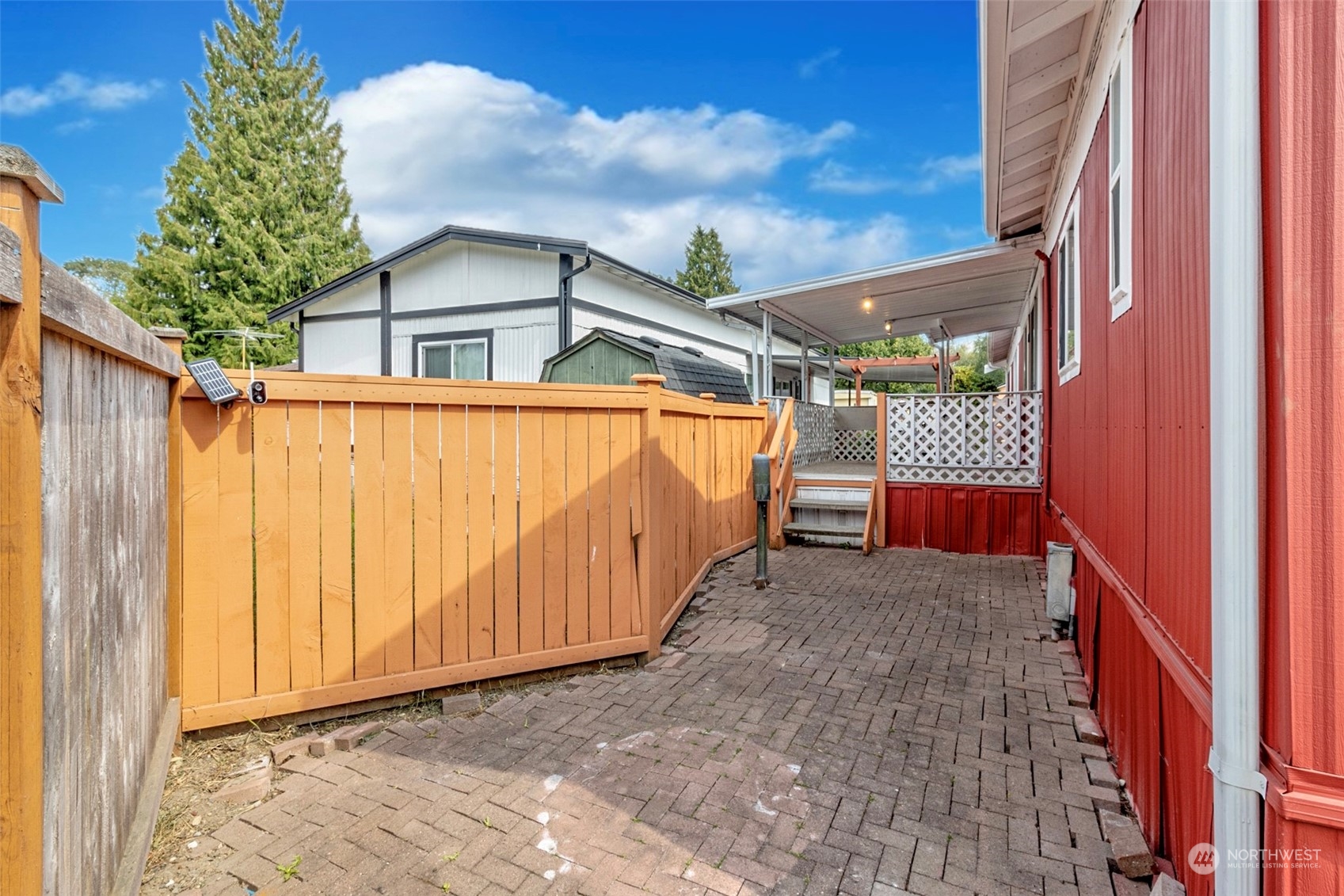 415 Lakeview Road, Unit E7 Lynnwood, WA 98087 - Photo 18 of 20 a view of a house with a small yard and wooden fence