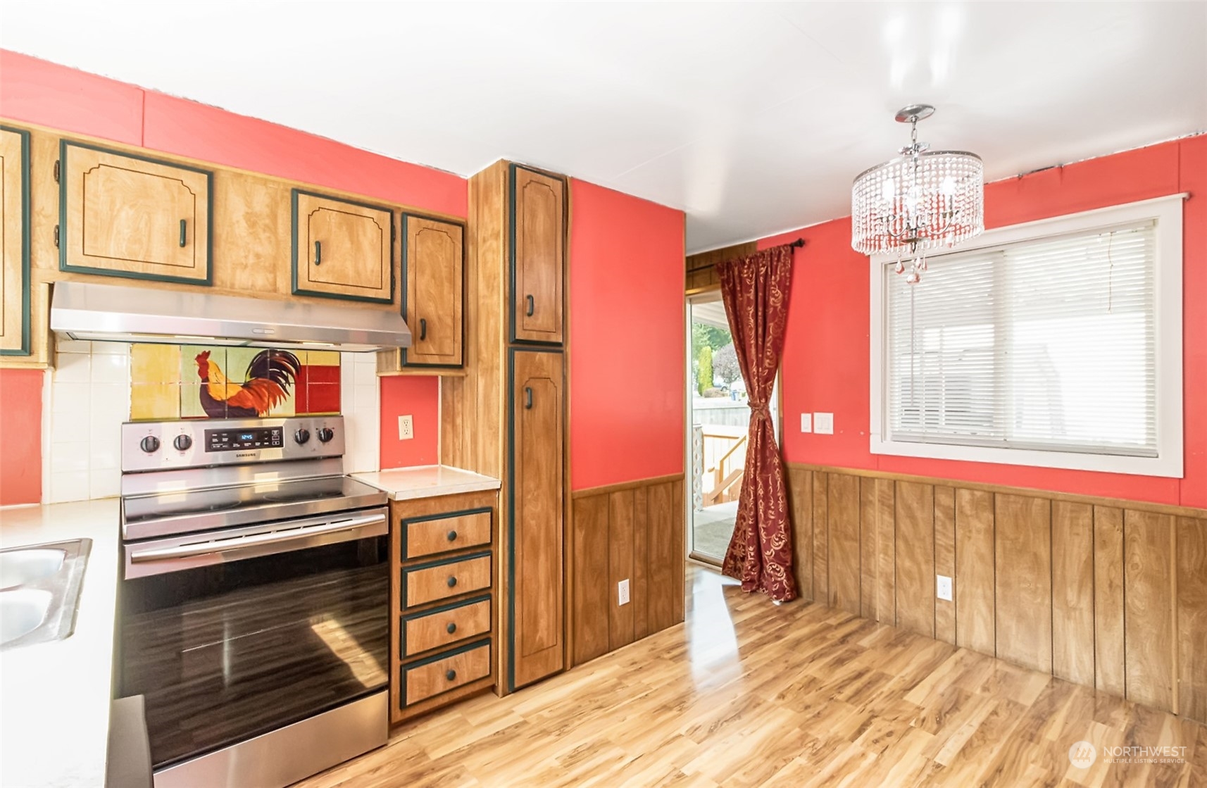 415 Lakeview Road, Unit E7 Lynnwood, WA 98087 - Photo 6 of 20 a kitchen with stainless steel appliances granite countertop a stove and a refrigerator