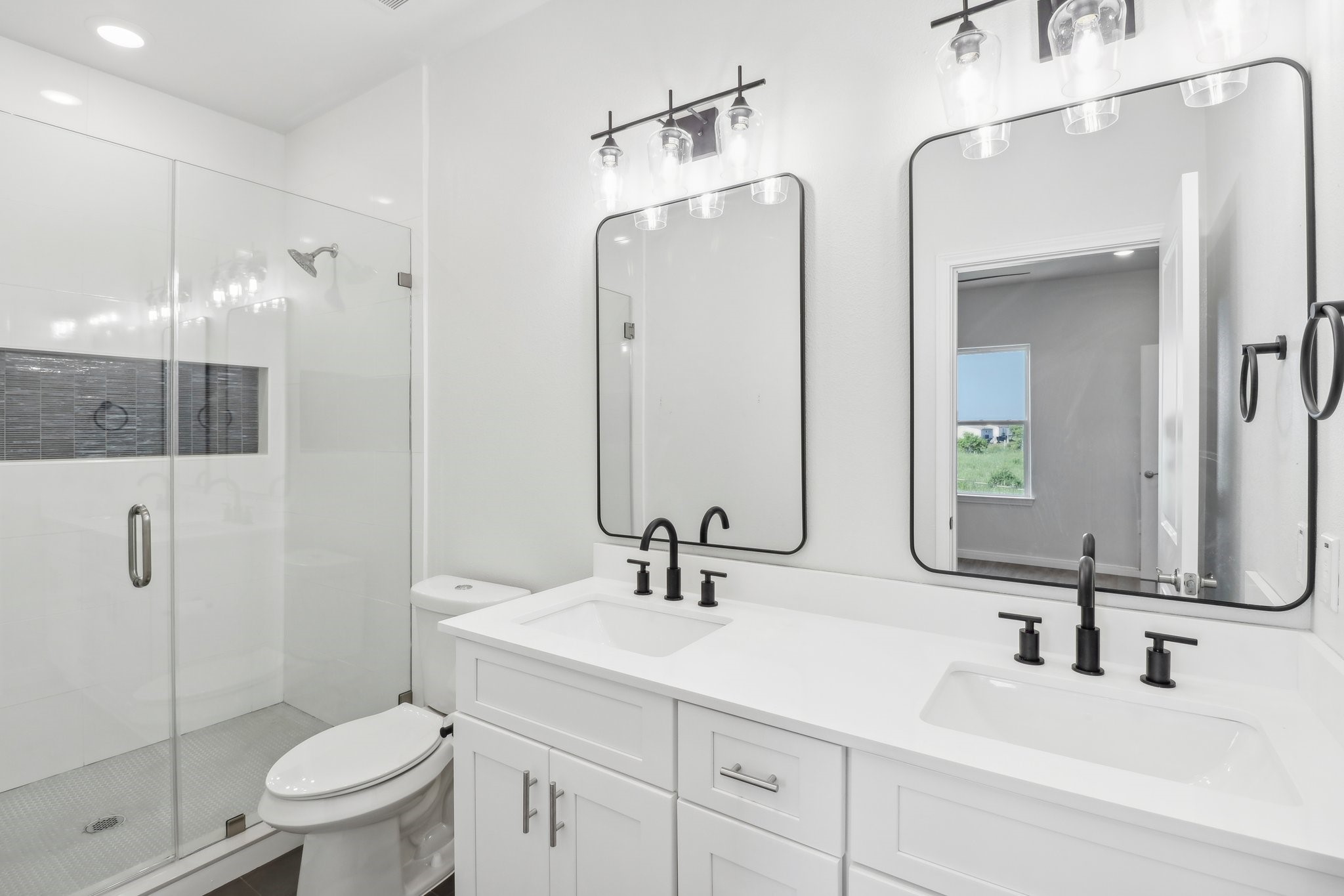 1326 Sapphire Palms Court San Leon, TX 77539 - Photo 13 of 20 a bathroom with a double vanity sink toilet and shower