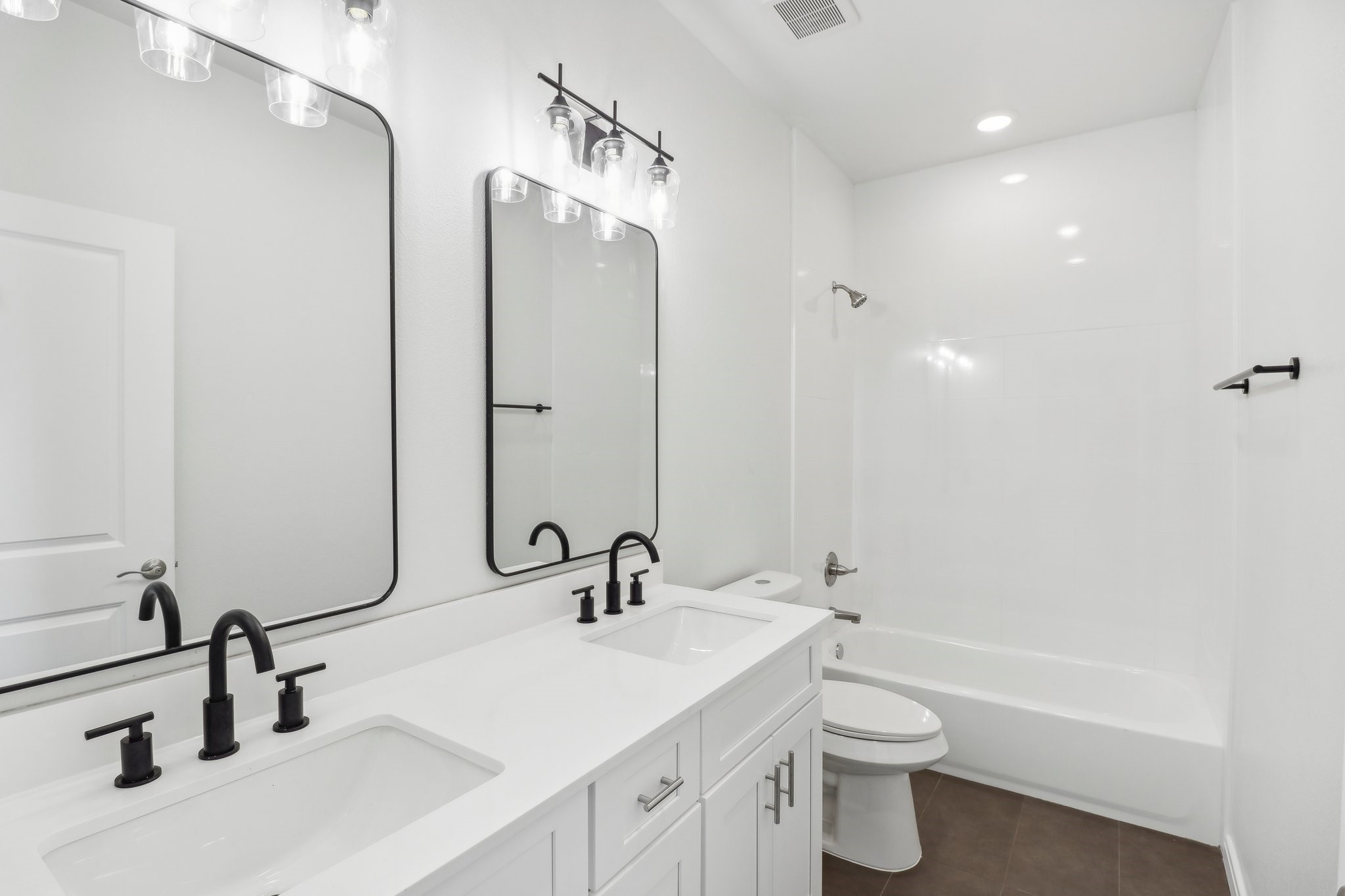 1326 Sapphire Palms Court San Leon, TX 77539 - Photo 15 of 20 a bathroom with a toilet sink and mirror