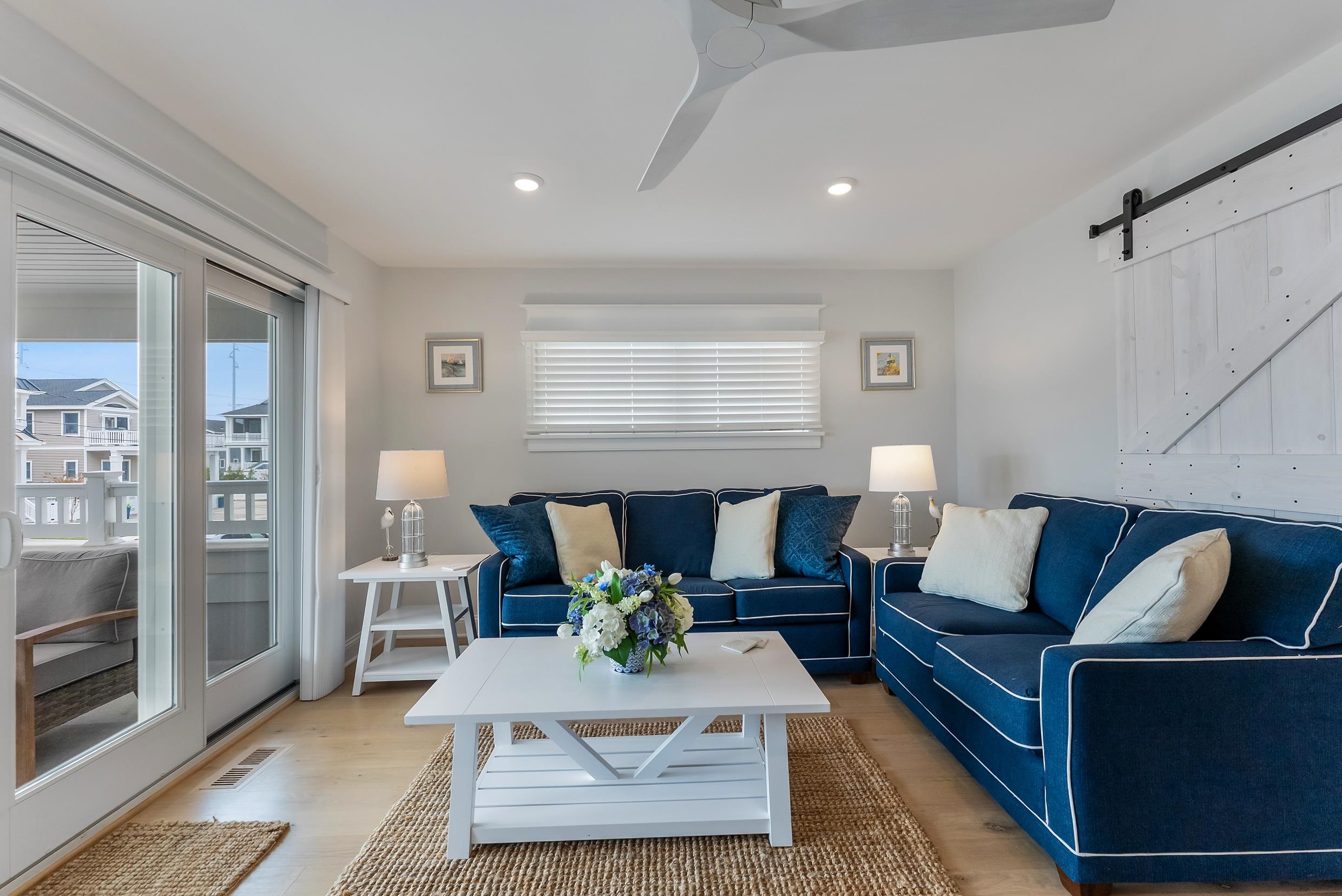253 35th, Unit WEST Avalon, NJ 08202 - Photo 13 of 43 a living room with furniture and a window