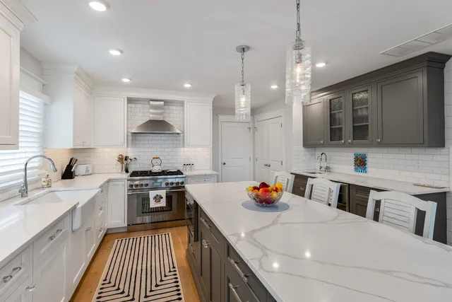 a utility room with sink dryer and washer