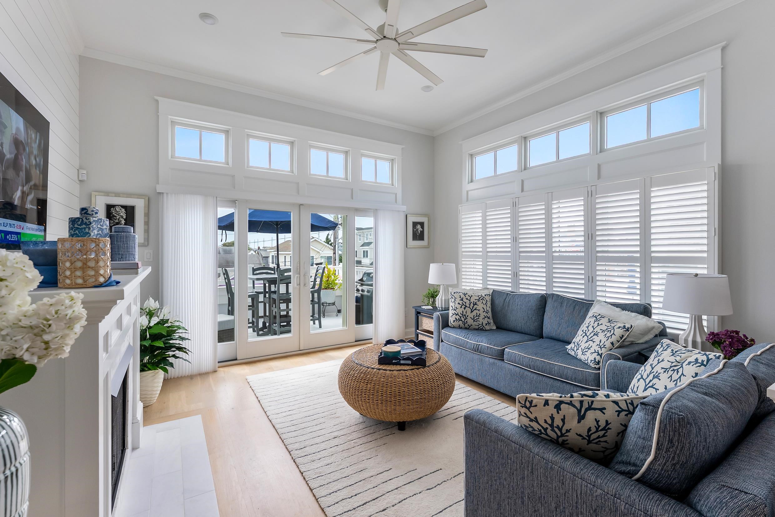 253 35th, Unit WEST Avalon, NJ 08202 - Photo 28 of 43 a living room with furniture and a large window
