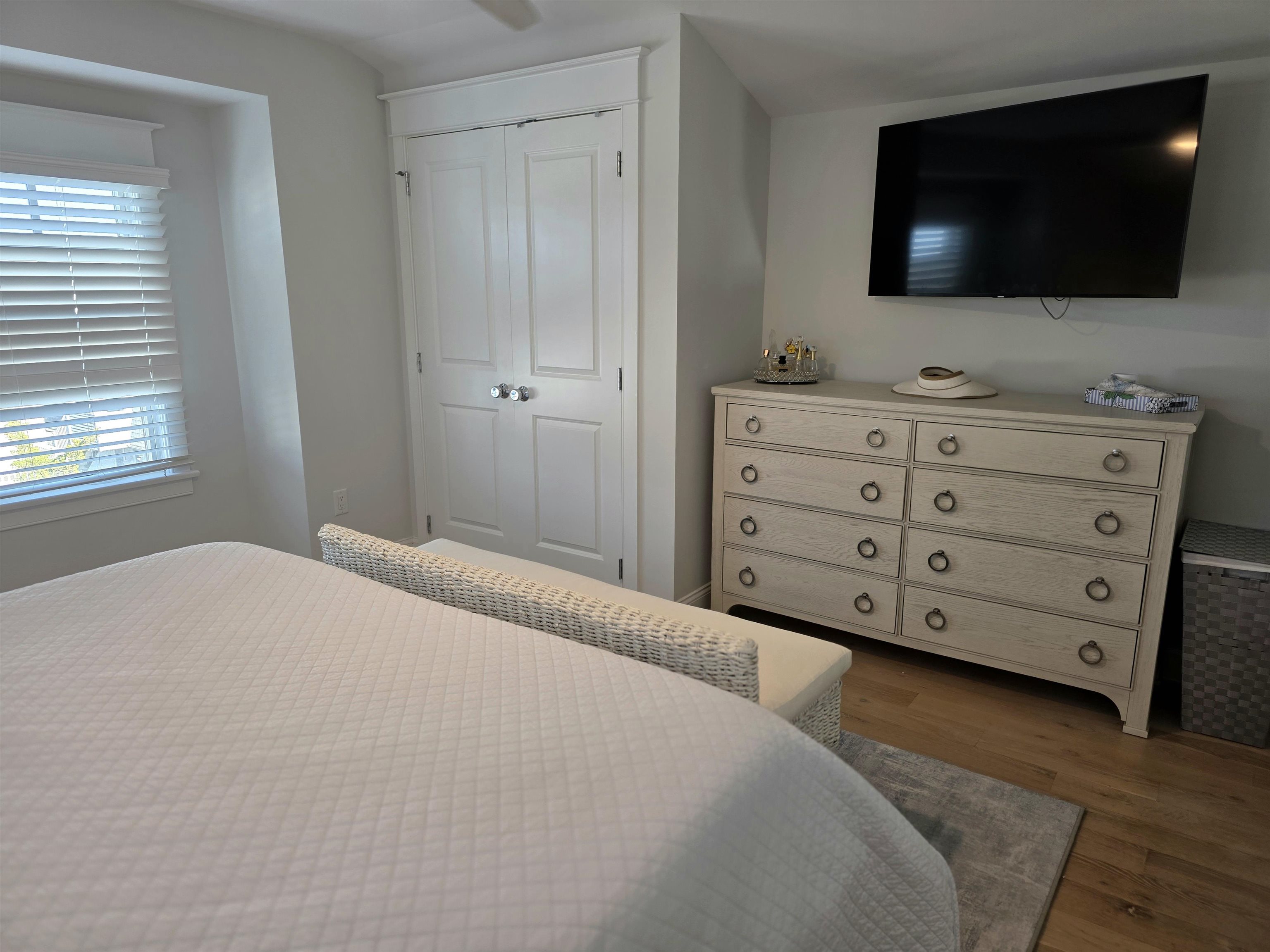 253 35th, Unit WEST Avalon, NJ 08202 - Photo 37 of 43 a bedroom with a bed and a flat screen tv
