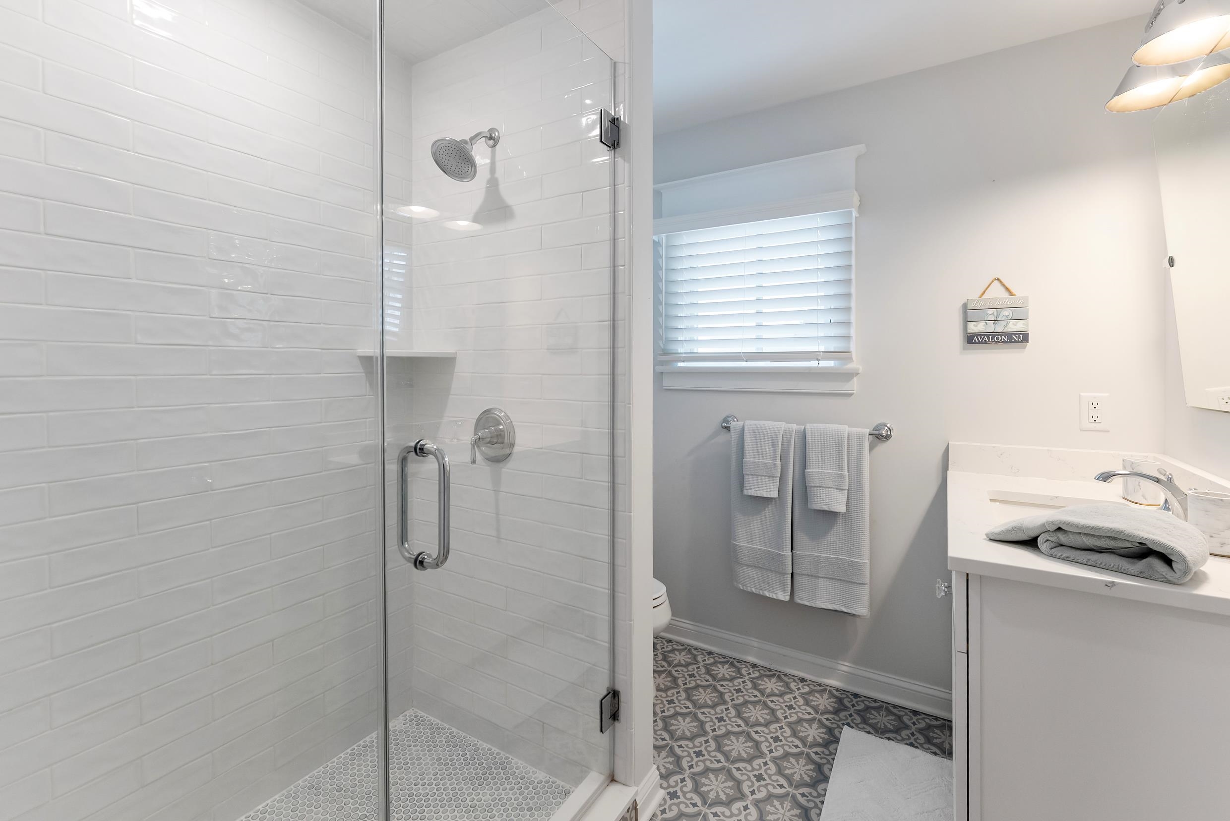 253 35th, Unit WEST Avalon, NJ 08202 - Photo 10 of 43 a bathroom with a tub and shower