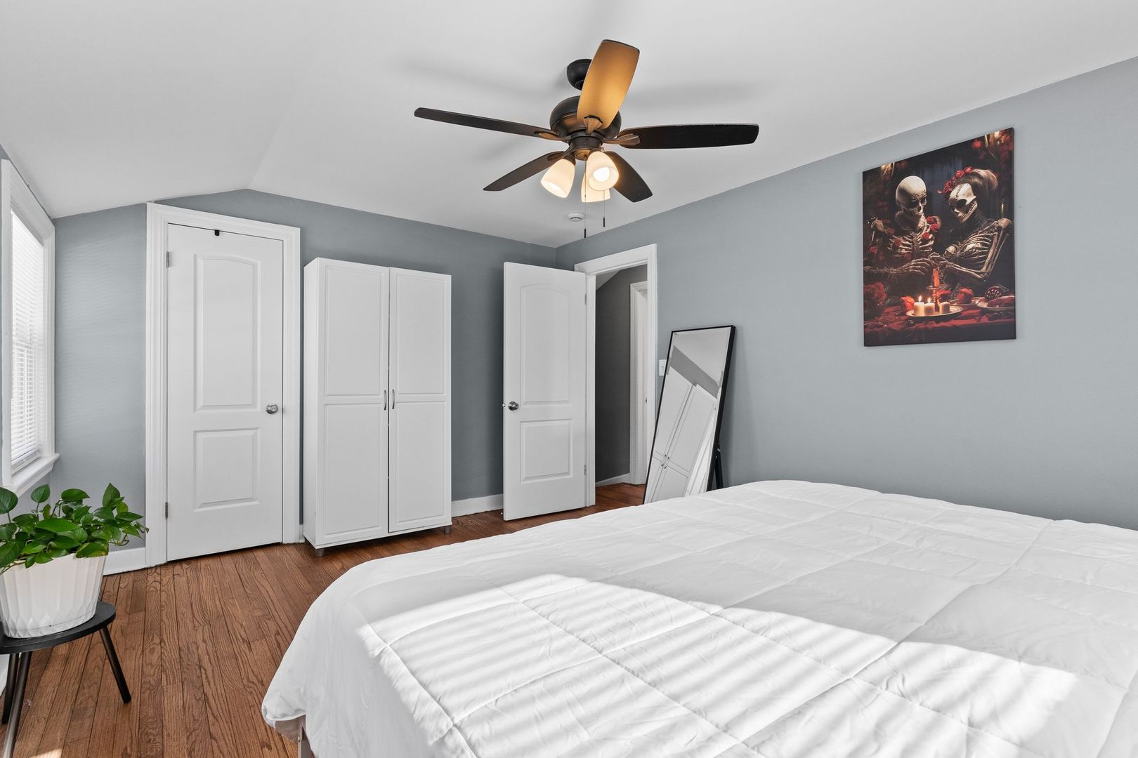 2023 South 23rd Avenue Broadview, IL 60155 - Photo 12 of 28 a bedroom with a bed and a chandelier