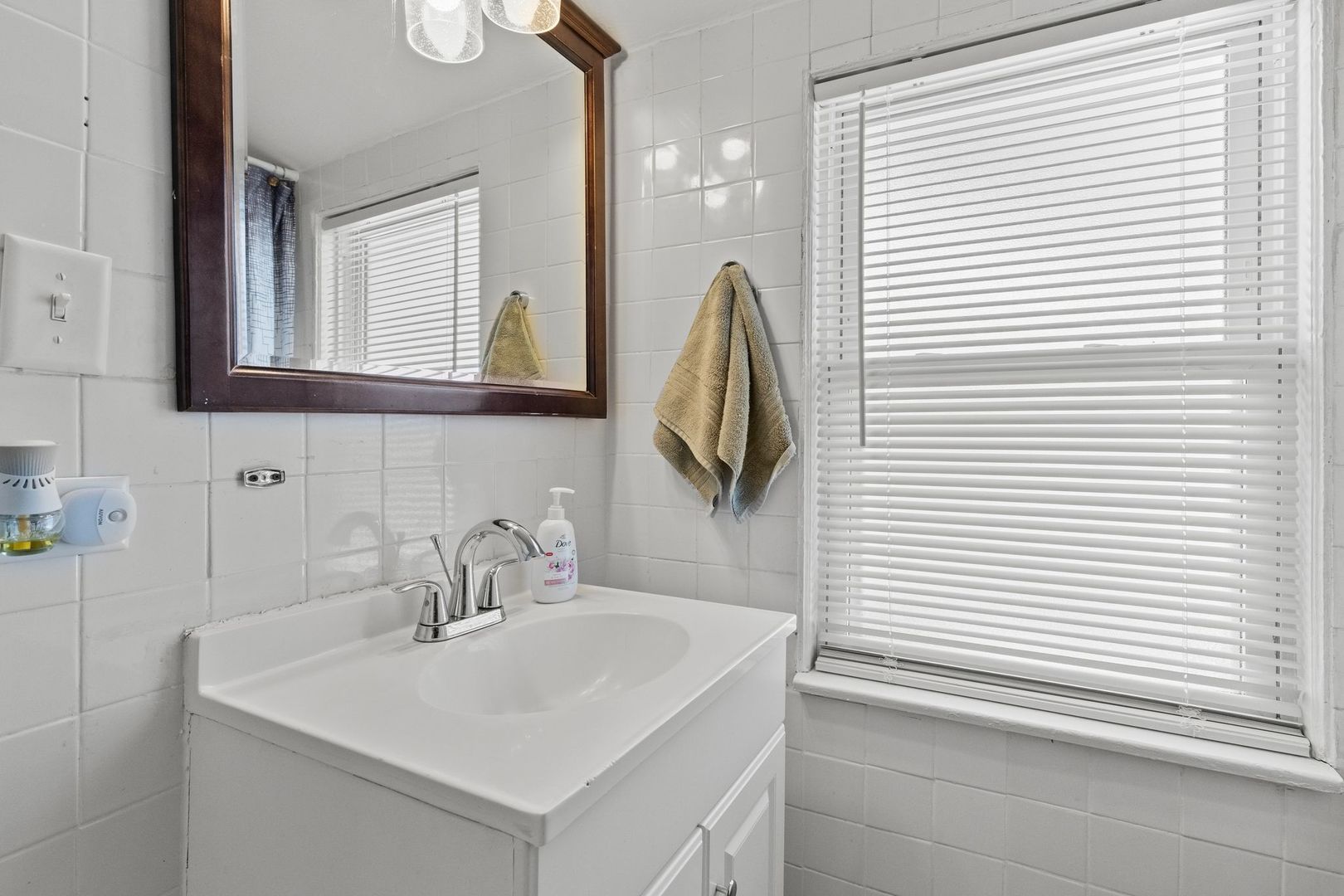 2023 South 23rd Avenue Broadview, IL 60155 - Photo 14 of 28 a bathroom with a sink and a mirror
