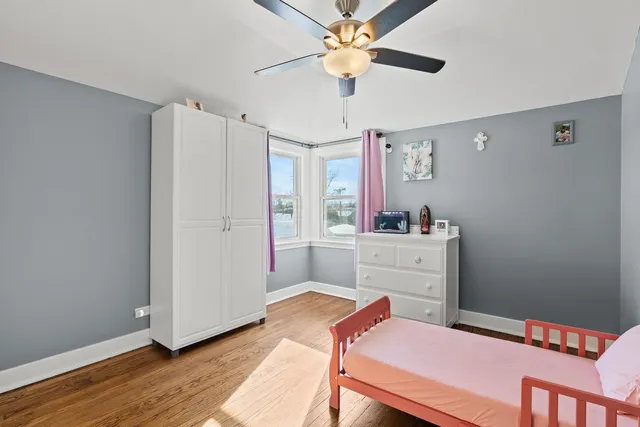 a bed room with a bed and a chandelier