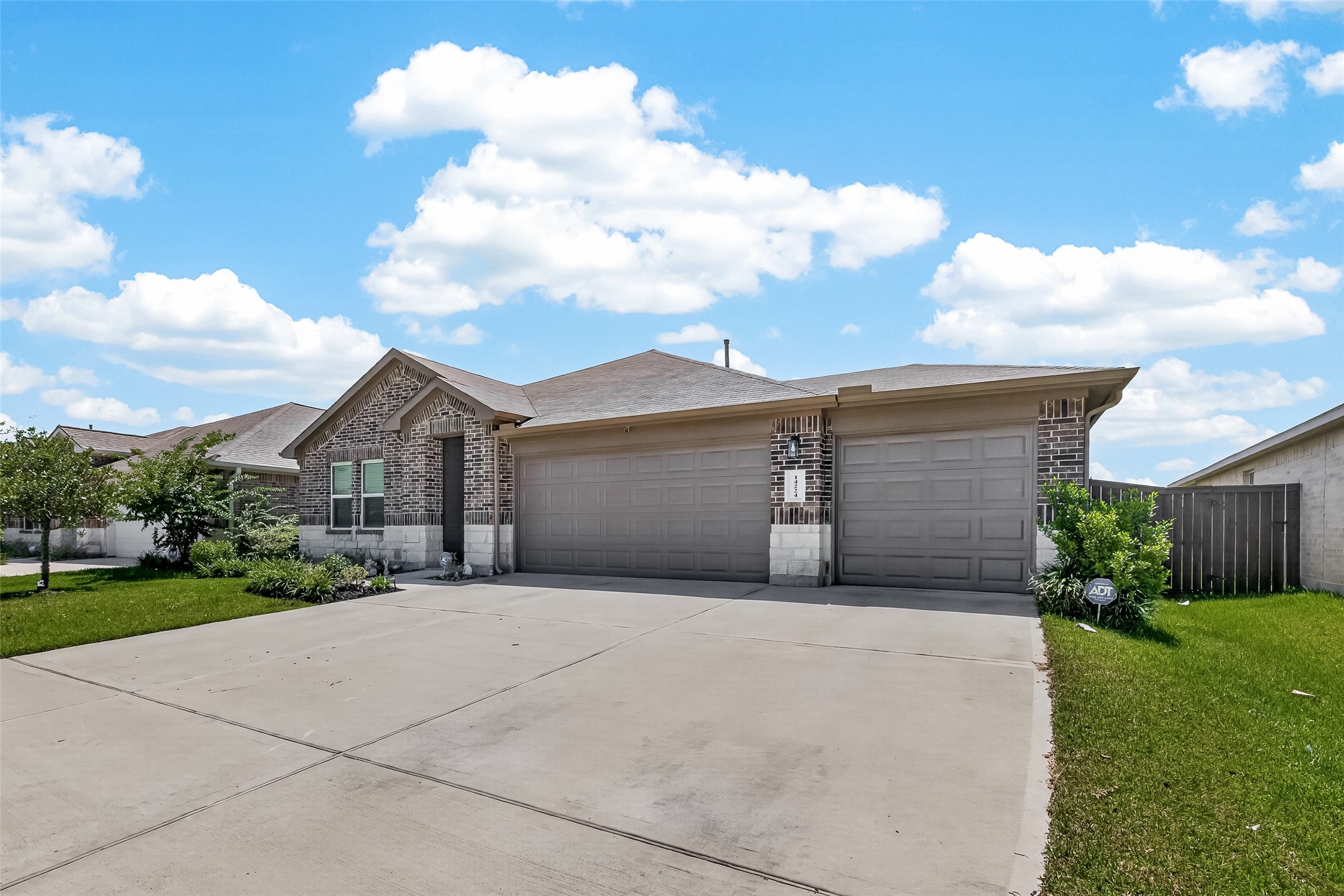 14224 Dream Road New Caney, TX 77357 - Photo 3 of 40 Exterior of home showcasing 3 car garage and over sized driveway