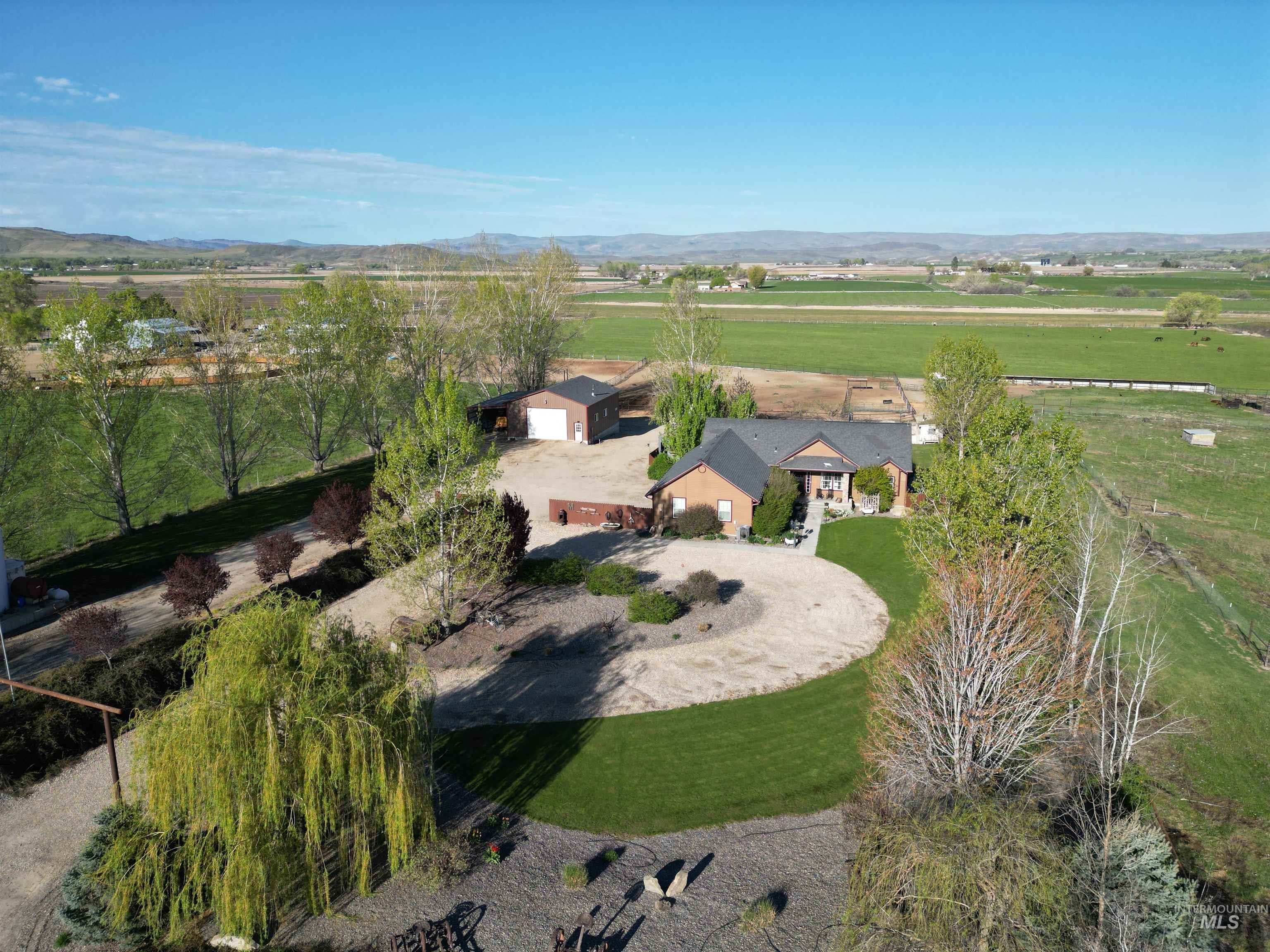 4243 Homestead Road Homedale, ID 83628 - Photo 1 of 50 Aerial view of property and surrounding area featuring a mountainous background