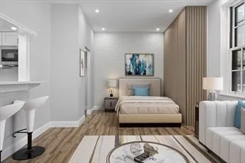 a spacious bedroom with a bed and a couch
