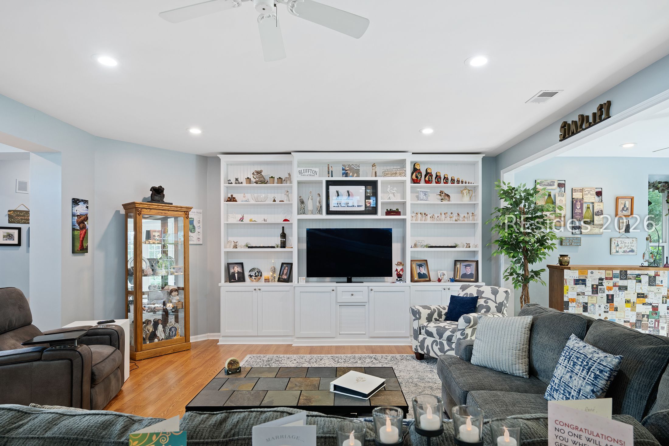 134 Commodore Dupont Street Bluffton, SC 29909 - Photo 24 of 40 Living Room with bookshelves and cabinetry