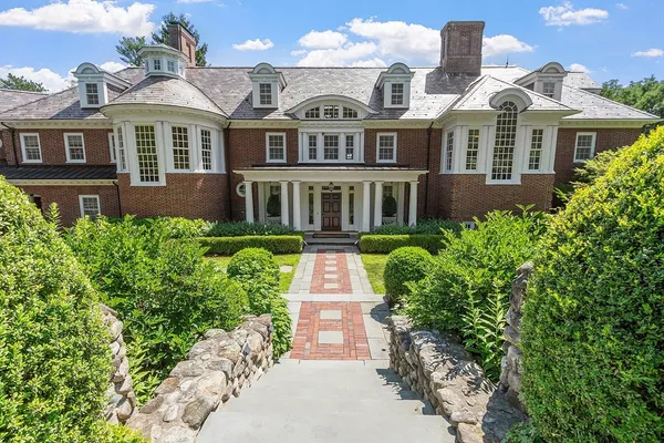 a front view of a multi story residential apartment buildings