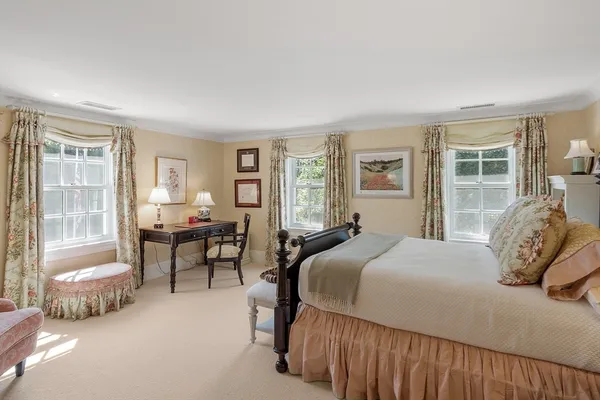 a spacious bathroom with a tub shower and sink