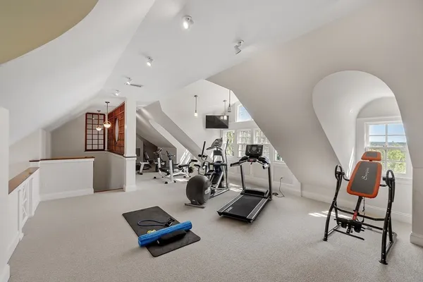 a view of stairs and wooden floor