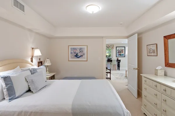 a living room with furniture and kitchen view