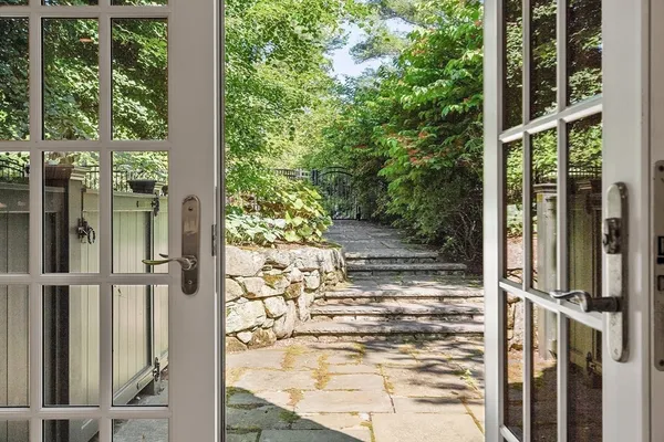 a view of backyard of house with green space