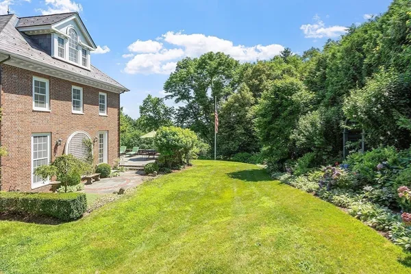 a front view of a residential apartment building with a yard