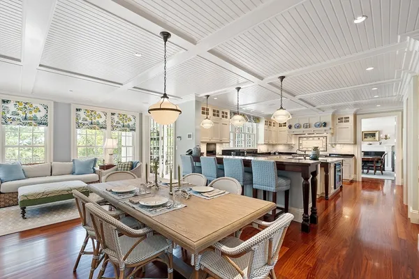 a view of a dining room with furniture wooden floor and chandelier