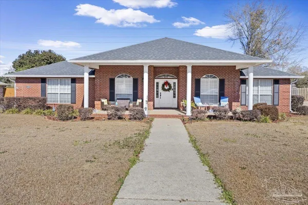 a front view of a house with a yard