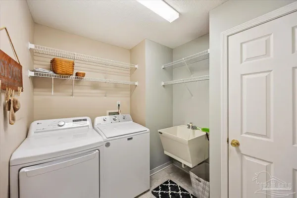 a utility room with dryer and washer