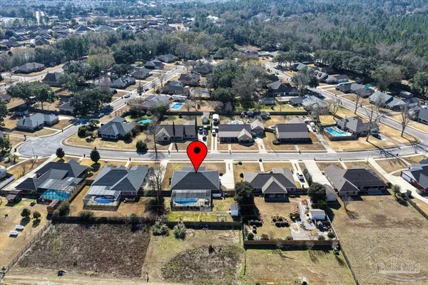 an aerial view of residential houses with outdoor space