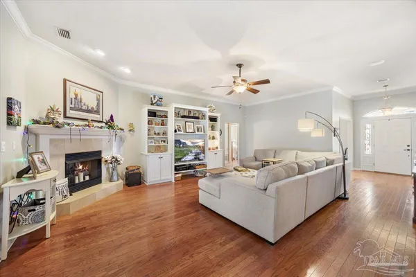 a living room with furniture and a fireplace