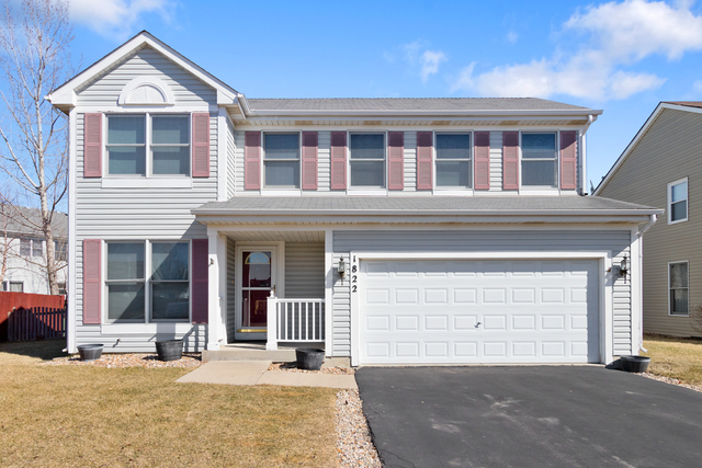 1822 Olde Mill Road Plainfield, IL 60586 - Photo 1 of 29 a front view of a house with a yard and garage
