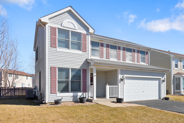 1822 Olde Mill Road Plainfield, IL 60586 - Photo 2 of 29 front view of a house with a yard